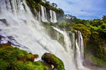 Picturesque ledges form the famous waterfalls. Complex of waterfalls Iguazu on the border of Argentina, Brazil and Paraguay. The concept of extreme and ecological tourism