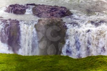 Gullfoss - Golden Waterfall. The most picturesque and popular waterfall in Iceland. Falls on the Hvitau River. Cloudy and foggy July day in Iceland. The concept of extreme and phototourism
