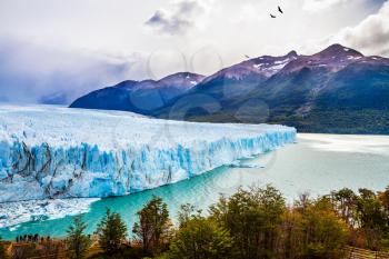 Argentine Province of Santa Cruz, Patagonia. Unique lake and glacier Perito Moreno,  in a mountain valley. The concept of  exotic and extreme tourism