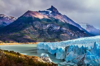 Patagonian province of Santa Cruz, Lake Argentino. On the surface of the glacier Perito Moreno formed Calgaspors - penitent firn.  The concept of exotic and extreme tourism