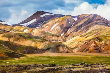  National Park Landmannalaugar. On the gentle slopes of the mountains are snow fields and glaciers. Magnificent Iceland in the July