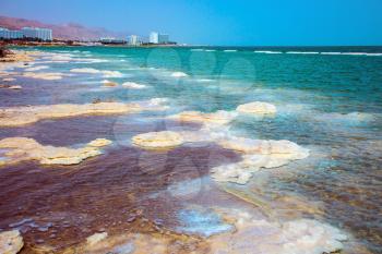 Israel, spring. Evaporated salt along the shore of the Dead Sea. The concept of ecological and medical tourism