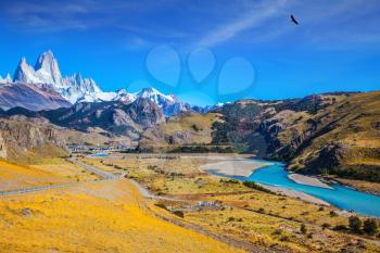 Amazing Patagonia. The white top of Fitzroy rocks covered the midday sun. The drying-up river in the valley of town of El Chalten