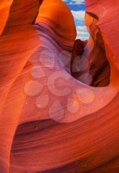 Arizona, USA. Fantastic slot canyon Antelope in the Navajo reservation. Mysterious red tunnel and blue sky