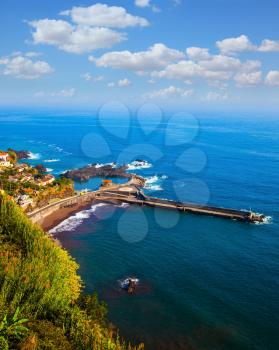 The magical tropical island of Madeira. Picturesque village and boat pier on the cape