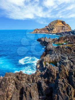  Extremely beautiful coast of Madeira. Rocks, bays and grottoes at coast of Atlantic. Concept of exotic and ecological tourism