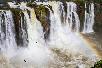 Complex of the most abounding in water Iguazu Falls in the world on border of Argentina, Brazil and Paraguay. Concept of active and extreme tourism