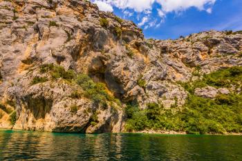 Concept of ecological and active tourism. The Verdon River flow between the sheer cliffs of Verdon Canyon. The Provence Alps, France. The journey through the azure waters