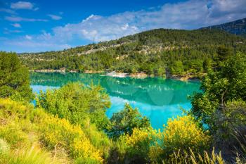 The biggest mountain canyon in Europe - Verdon. Spring Provence. Smooth-blue water reflecting the clouds