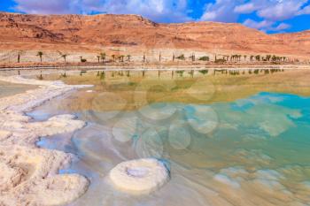 Evaporated salt out of the water with beautiful patterns. Lowering the water level in the Dead Sea