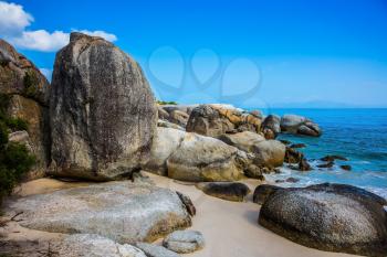 Huge boulders on the ocean shore. Travel to South Africa, the Atlantic Ocean