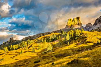 Last sunny day of fall. To pass Faltsarego approaching snowstorm. Concept of active and extreme tourism. Travel in the Dolomites