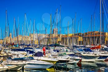  Rows of sailing yachts, motor boats and fishing boats. The water area of Marseille Old Port