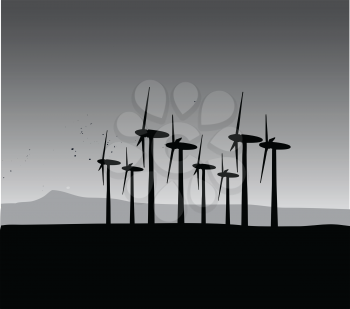 black and white windmill silhouettes on landscape