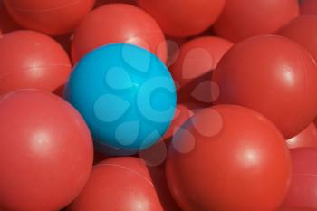 Royalty Free Photo of Red Balls With One Blue One