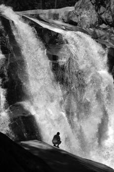 Royalty Free Photo of a Hiker at a Waterfall in King's Canyon National Park