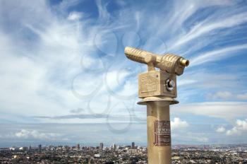 Royalty Free Photo of a Telescope Overlooking a City