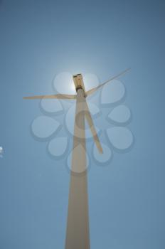 Royalty Free Photo of a Wind Turbine From Below Blocking the Sun