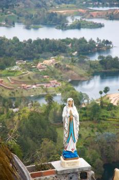 Sculpture of the Virgin Mary in the El Penol rock, near Medellin, Colombia.
