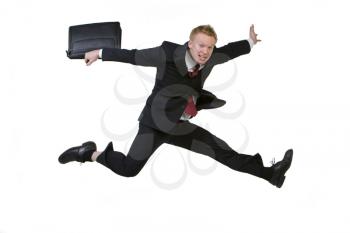 Royalty Free Photo of a Man Leaping With a Satchel