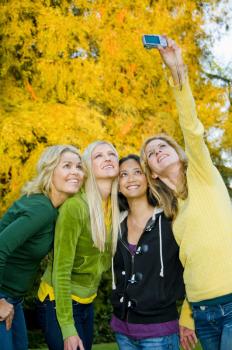 Royalty Free Photo of Four Woman Taking a Self Portrait