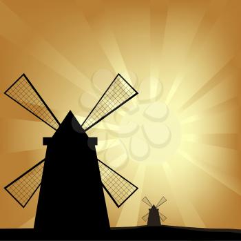 Royalty Free Clipart Image of Windmills at Sunrise