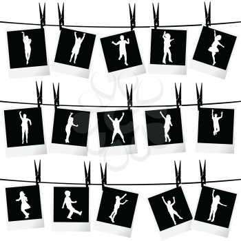 Collection of photo frames hanging on rope with children silhouettes