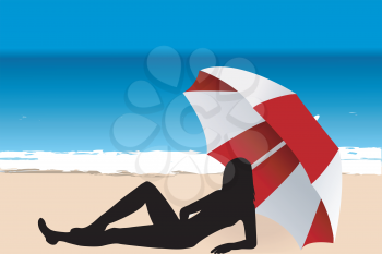 Young woman silhouette lying under an umbrella on the beach