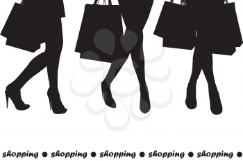 Women silhouettes holding shopping bags