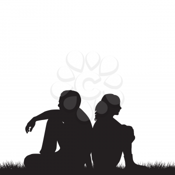 Silhouettes of sad couple sitting back to back