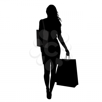 Silhouette of woman with shopping bags