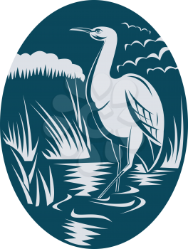 Royalty Free Clipart Image of a Heron Wading in a Marsh