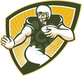 Illustration of an american football gridiron running back player running with ball facing front done in retro style set inside shield.