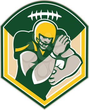 Illustration of an american football gridiron running back player running with ball facing front fending set inside shield crest with ball on top done in retro style.