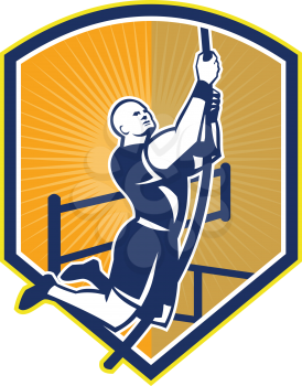 Illustration of a crossfit athlete body weight exercise rope climb hanging facing side set inside shield crest done in retro style on isolated white background