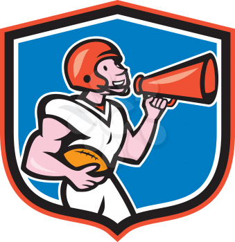 Illustration of an american football gridiron quarterback player holding bullhorn blowhorn shouting facing side set inside crest shield on isolated background done in cartoon style.