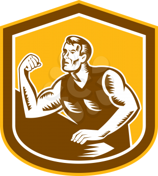 Illustration of an arm wrestling champion flexing muscles viewed from front set inside shield on isolated background done in retro woodcut style.