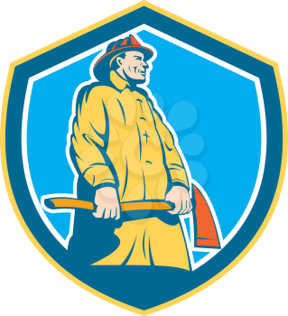Illustration of a fireman fire fighter emergency worker standing holding axe viewed from low angle set inside shield crest on isolated background done in retro style. 
