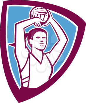 Illustration of a netball player shooting ball set inside shield crest on isolated background done in retro style. 