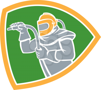 Illustration of a sandblaster worker holding sandblasting hose wearing helmet visor viewed from the side set inside shield crest on isolated background done in retro style.