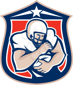 Illustration of an american football player with helmet on holding ball set inside shield crest viewed from the front done in retro style. 