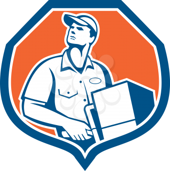 Illustration of a delivery worker delivering parcel package carton box showing on a dolly hand trolley set inside shield crest on isolated background done in retro style.