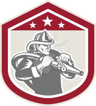 Illustration of a fireman fire fighter emergency worker with fire hose set inside shield crest shape done in retro woodcut style on isolated background.