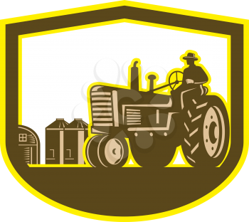 Illlustration of a farmer worker driving a vintage tractor plowing farm field set inside shield crest done in retro style on isolated background.