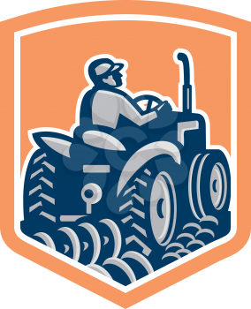 Illlustration of a farmer worker driving a tractor plowing farm field rear view set inside shield crest done in retro style.