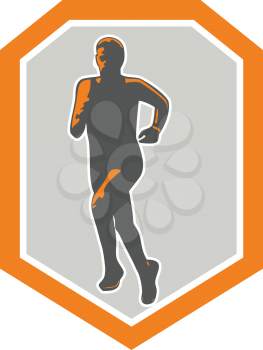 Illustration of marathon triathlete runner running facing front view set inside shield crest on isolated done in retro style.