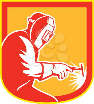 Illustration of welder worker working holding welding torch viewed from side set inside shield crest on isolated background done in retro style.