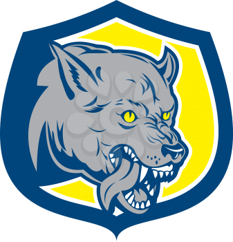 Illustration of an angry wild dog wolf head growling snarling tongue out agressive set inside shield crest done in retro style on isolated background. 