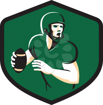 Illustration of an american football gridiron quarterback player holding ball shouting facing side set inside crest shield on isolated background done in retro style.