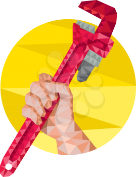Low polygon illustration of a hand holding monkey wrench viewed from the side set inside circle on isolated background.